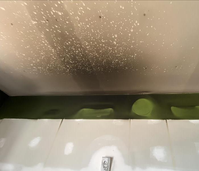 white ceiling covered in black soot 