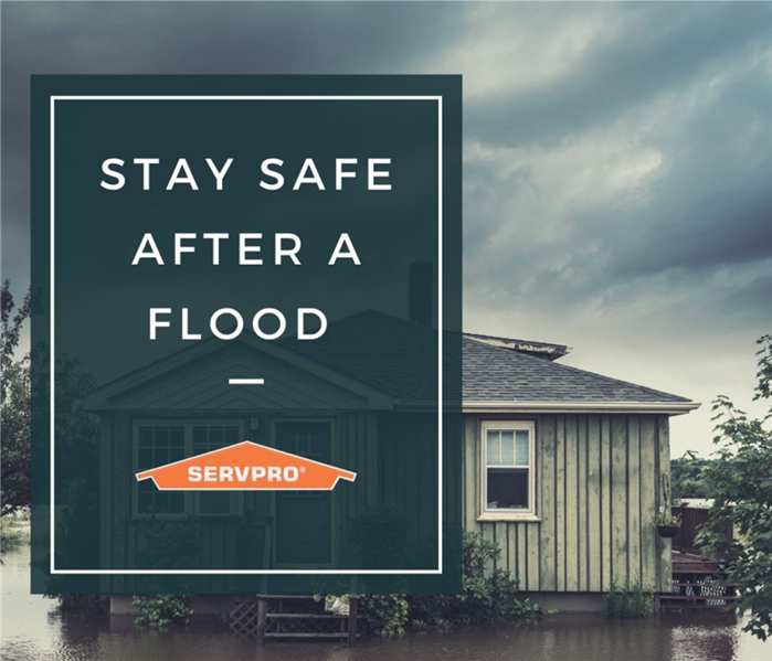 “Stay safe after a flood” with home in a flooded area and the SERVPRO logo