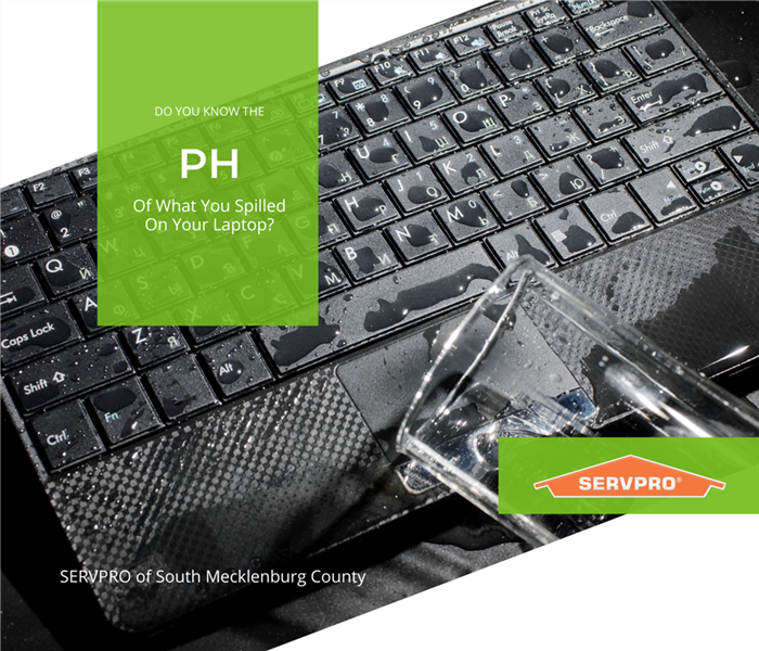 “do you know the PH of what you spilled on your laptop” with water spilled on a laptop and SERVPRO logo