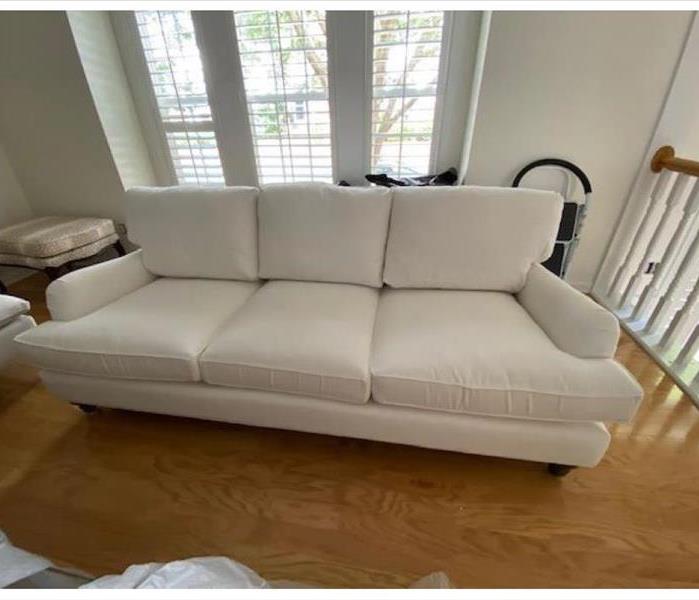 white couch cleaned and restored after fire damage