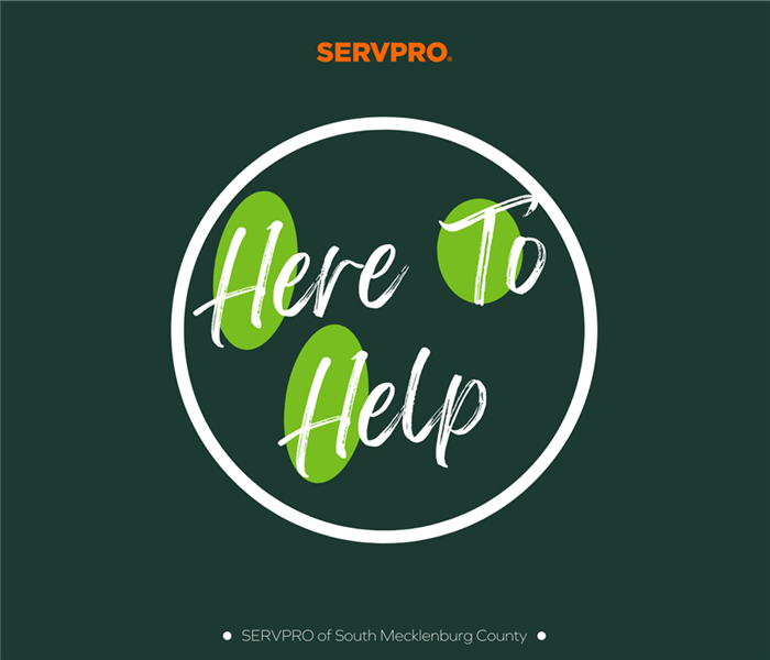 “Here To Help” in a circle with a dark green background and the “SERVPRO” logo