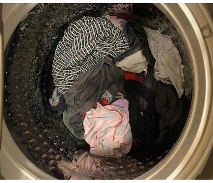 Washing machine with dirty clothes